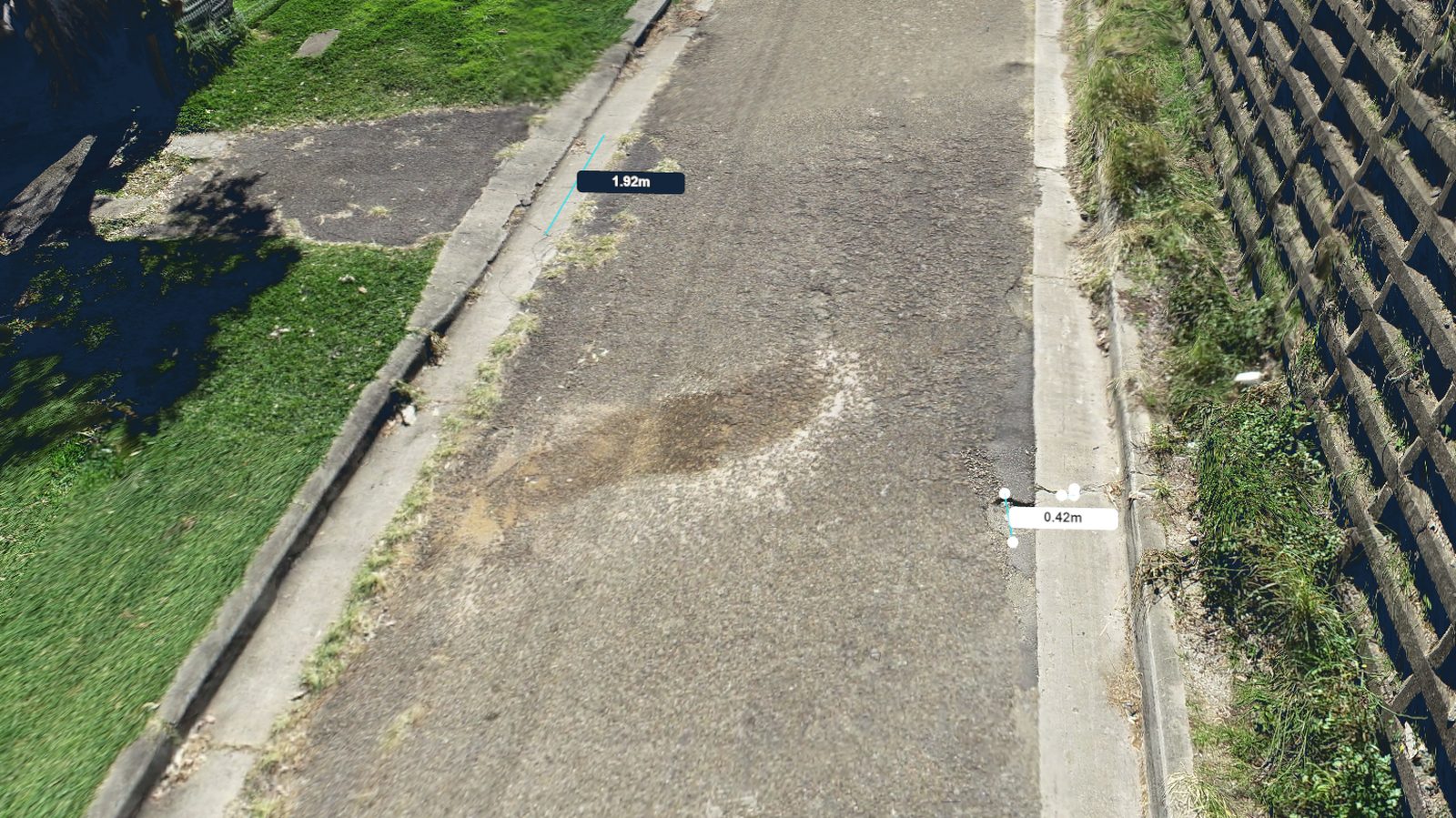 3D model of a residential street with a pavement defect and kerb displacement measured at 1.92 m and 0.42 m
